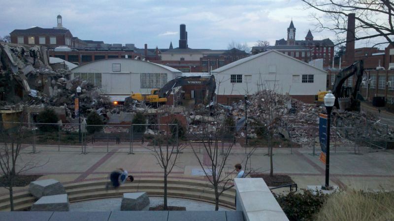 Parkour athletes train on the decorative stone benches and walls beneath the opulent Shelby Engineering Center at Auburn University. The ruins of recently demolished Dunstan Hall lie in the background.